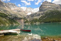 
Canoe and Boat On Lake O'Hara With Mount Victoria, Mount Lefroy, Yukness Mountain From Trail Around Lake O'Hara
